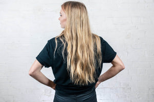 woman wearing black t-shirt made by Rhetorik 